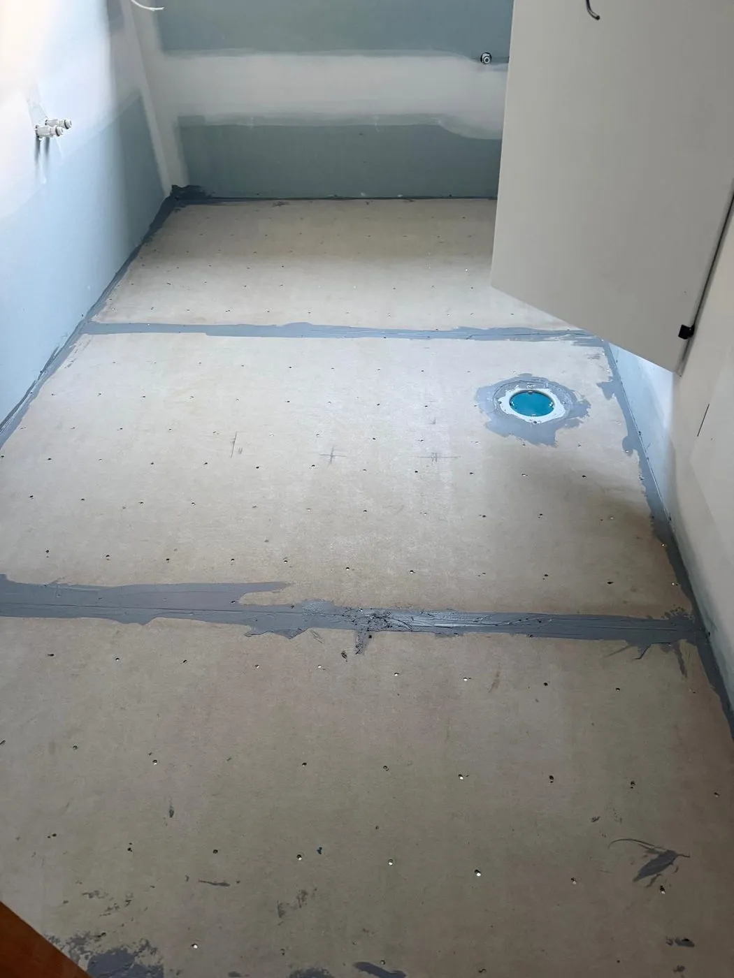 Bathroom floor screeded and prepared for tiling